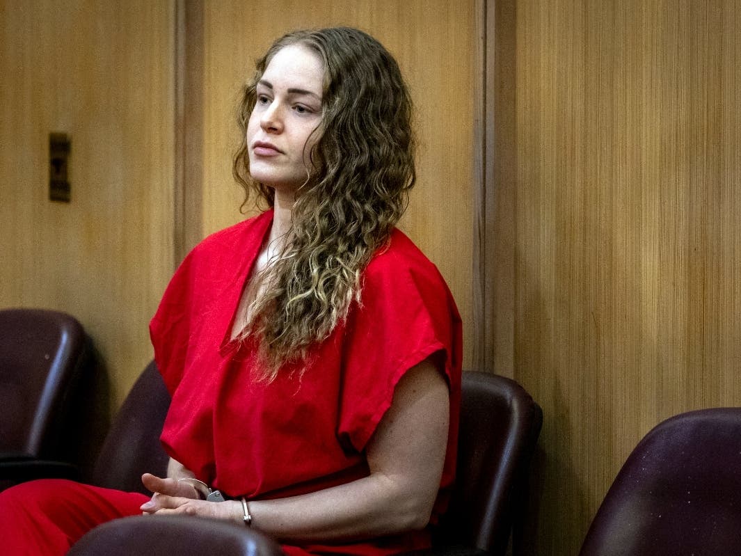 Courtney Clenney, a social media model accused of killing her boyfriend, sits in the courtroom before the start of a hearing, Thursday, Feb. 1, 2024, at the Miami Dade Criminal Courthouse in Miami. 