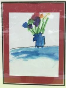 Child's watercolor painting of brightly colored flowers in a blue vase.