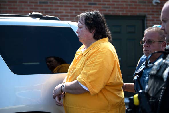 Defendant Robert Atkins is escorted to the police car after his preliminary hearing for the 1991 murder and arson of Joy Hibbs, 35, of Bristol Township on Wednesday, Sept. 21, 2022.