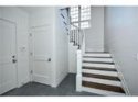 Mudroom with view of door to garage and security key pad.jpg