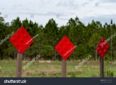 stock-photo-red-diamond-end-of-road-lane-markers-for-traffic-and-construction-on-dead-end-stre...jpg