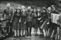 SS-auxiliaries-poses-at-a-resort-for-Auschwitz-personnel.-From-laughing-at-Auschwitz-c.-1942.jpg