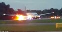 35B4E16F00000578-3661493-A_Singapore_Airlines_plane_has_caught_fire_pictured_on_the_runwa-m-7_14.jpg