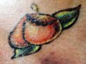 peach tattoo from tattoo artist article.jpg