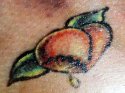 peach tattoo from tattoo artist article copy.jpg