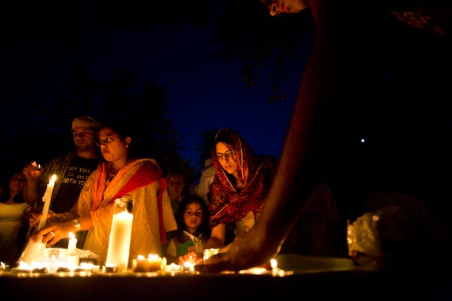 Candles are placed on a table during a vigil at the Sikh Religious Society of Wisconsin August 6, 2012, to mourn the victims of the Sikh Temple shooting.