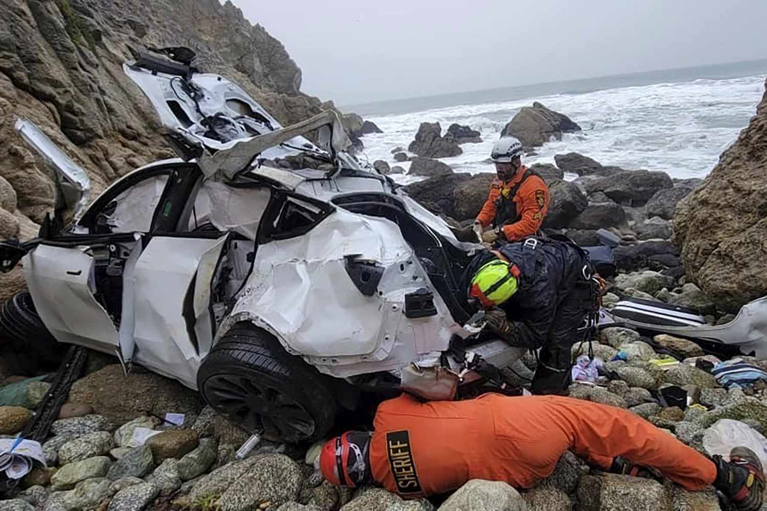 Mandatory Credit: Photo by Sgt Brian Moore/AP/Shutterstock (13744707a) In this photo provided by the San Mateo County Sheriff's Office, emergency personnel respond to a vehicle over the side of Highway 1 on Jan. 1, 2023, in San Mateo County, Calif. The driver of the car that plunged 250 feet off a cliff in Northern California, injuring his two young children and his wife, has been released from the hospital and jailed on suspicion of attempted murder and child abuse. The San Mateo County District Attorney's Office announced, that Dharmesh Patel is being held without bail California Car Falls Off Cliff, San Mateo County, United States - 04 Jan 2023
