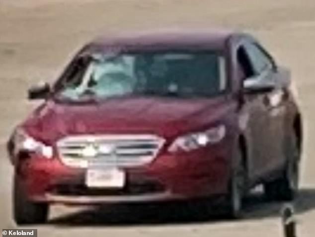 33278498-8741477-He_said_the_red_Ford_Taurus_had_a_huge_hole_in_the_passenger_sid-m-26_1600301869646.jpg