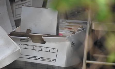 Boxes of evidence are searched and cataloged at the storage unit of Rex Heuermann at Omega Self Storage.