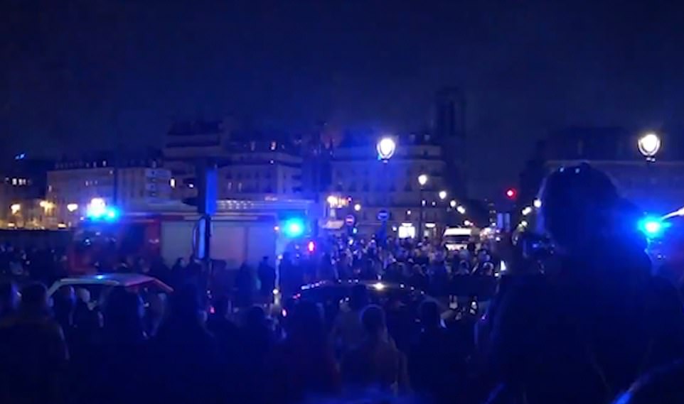 12322994-6925737-Parisians_applauded_and_cheered_fire_crews_as_they_drove_through-a-5_1555378125794.jpg