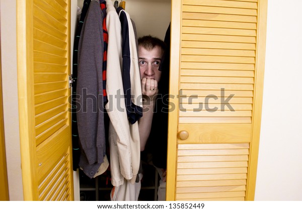 man-hiding-closet-600w-135852449.jpg