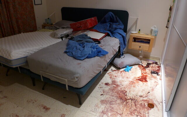 Blood covers the floor of a bedroom of a resident of Be'eri, on October 11, 2023. (Times of Israel/Canaan Lidor) Blood covers the floor of a bedroom of a resident of Be'eri, on October 11, 2023. (Times of Israel/Canaan Lidor)