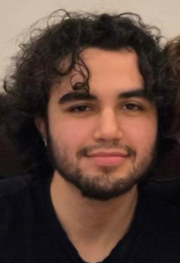 The young man is described as 5’10”, 140 pounds, with a slim build. He has curly black hair and brown eyes. The young man is described as 5’10”, 140 pounds, with a slim build. He has curly black hair and brown eyes.